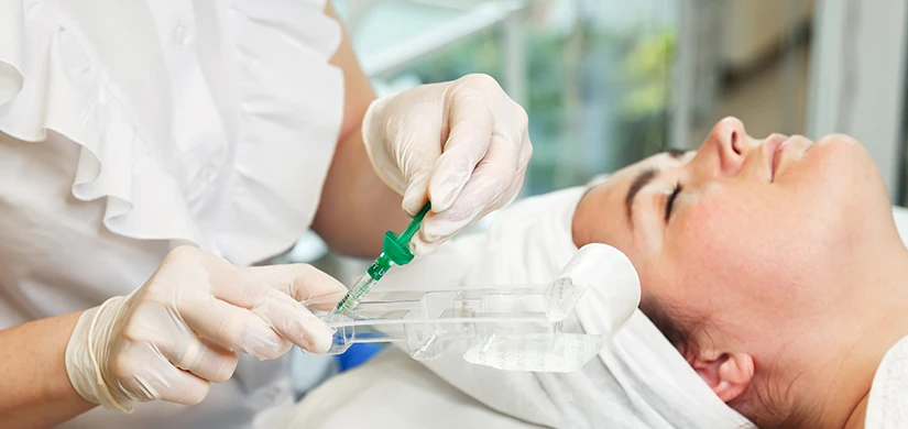 Clinician preparing an injectable facial treatment